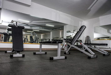 Fototapeta na wymiar Modern and empty gym interior with equipment