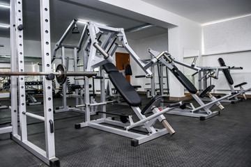 Fototapeta na wymiar Different sport equipment in gym as background