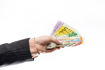 Male hand giving euro banknotes isolated on white
