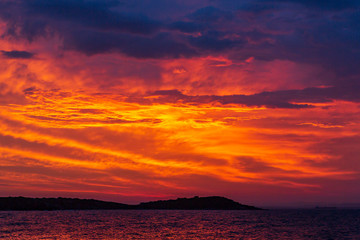 sunset on the beach of beautiful colorful clouds. summer sunrise to the ocean. wonderful sky and marvelous clouds.