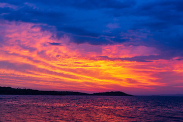 sunset on the beach of beautiful colorful clouds. summer sunrise to the ocean. wonderful sky and marvelous clouds.