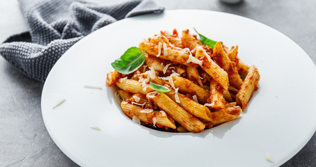 Bolognese penne pasta served on plate