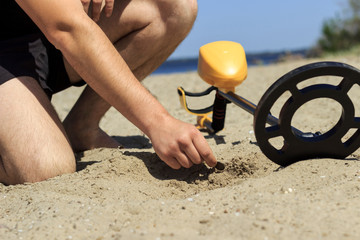 metal finder search on the beach