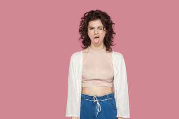 Portrait of crazy funny beautiful brunette young woman with curly hairstyle in casual style...