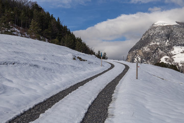 Fototapeta na wymiar snow covered road in mountains