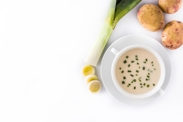 French vichyssoise soup with ingredients in bowl isolated on white background. Top view. Copyspace