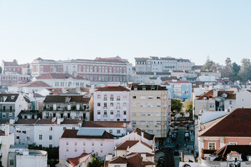 Fototapeta na wymiar Cute buildings in Lissabon on hill during summer