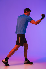 Portrait of a fit confident sportsman doing boxing