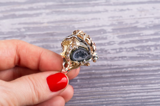 Semiprecious stones in a ring from silver with topaz and a ruby