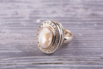 A ring with nacre in silver. The massive ring reminds ancient family ornament which transferred in aristocratic families from generation to generation