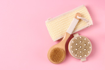 brush for dry massage on a colored background top view.