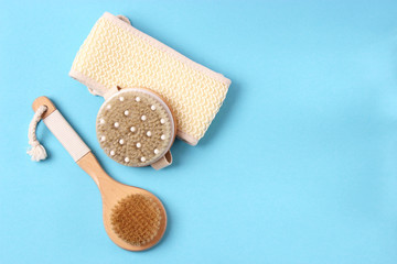 brush for dry massage on a colored background top view.