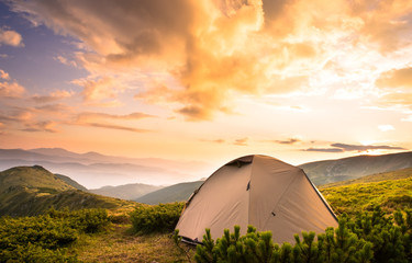 Camping tent in morning sun ray. Active lifestyle. Tatra mountains Zakopane, Poland