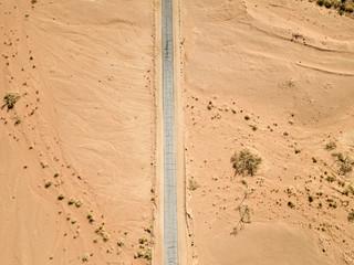 Old Desert road with cracked asphalt, Top down aerial image. - Powered by Adobe