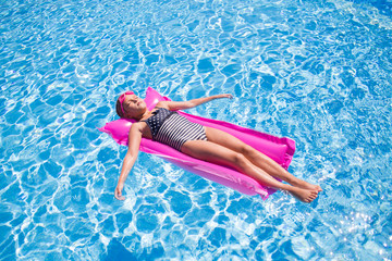 Children swim in  pool