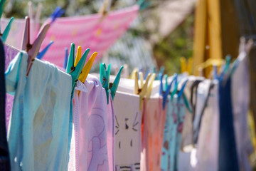 Color clothes hanging on line in garden