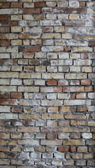 old weathered flaky brick wall