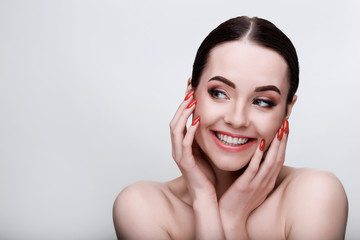 Portrait of model with natural nude make up with bare shoulders on gray background. Beautiful...