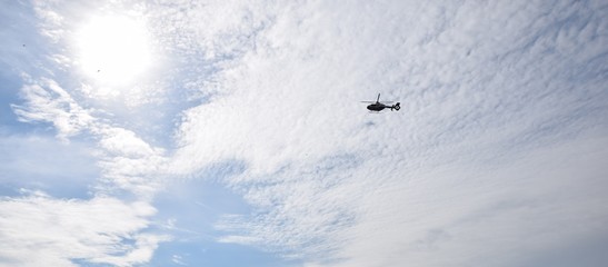 Helicopter in blue sky