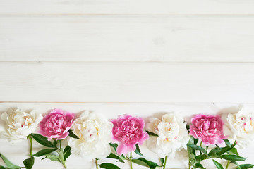packaging template, layout of peonies on wooden white background