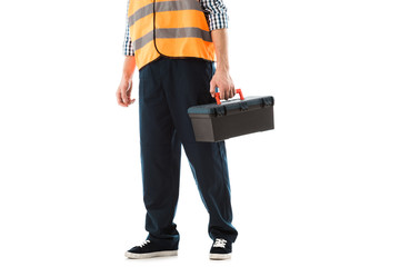 Naklejka premium cropped view of construction worker in safety vest holding toolbox isolated on white