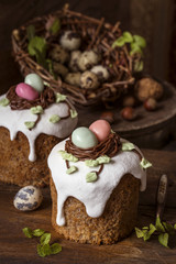 traditional sweet Easter cakes with icing on wooden background