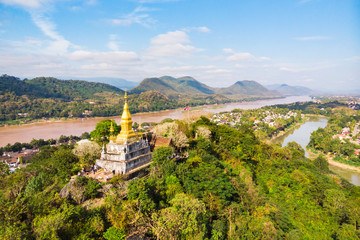 The golden pagoda of Wat Chom Si on the top of Mount Phou Si, Luang Prabang, Lao