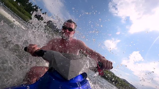 big spray close-up in the camera from the jet ski. super slowmo
