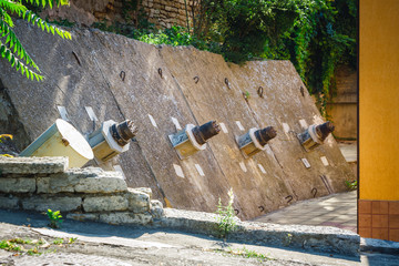 anchor bolts in the concrete wall, protecting the house from falling down the slope © dziewul