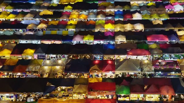 Night market called train night market Ratchada bird eye view, people visit to enjoy many kind of street food, located at back of Esplanade Ratchadapisek Department store, Bangkok, Thailand, Panning R