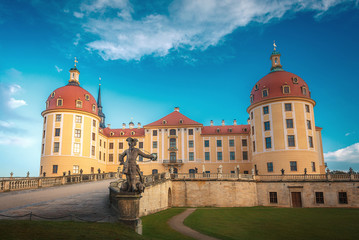 Fototapeta na wymiar Famouse Moritzburg Castle near Dresden lit by the setting sun in the autumn. Saxony, Germany, Europe. Creative image. Awesome nature landscape with rerfect sky. Popular Places for photographers