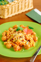 Delicious fusilli pasta with meatballs and cheese.