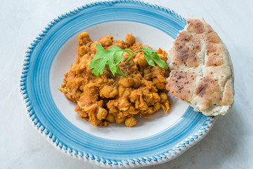 Chole or Chana Masala or Spicy Chickpeas is traditional North Indian main course recipe and usually served with Bhature or Roti/ Naan.
