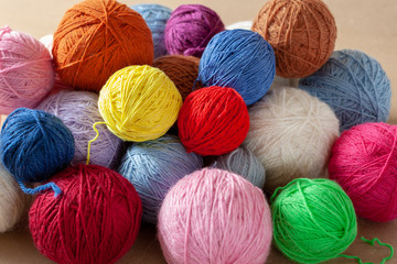 A bunch of colorful yarn balls.