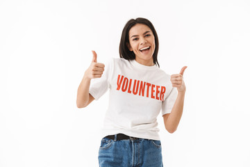 Smiling young girl wearing volunteer t-shirt standing