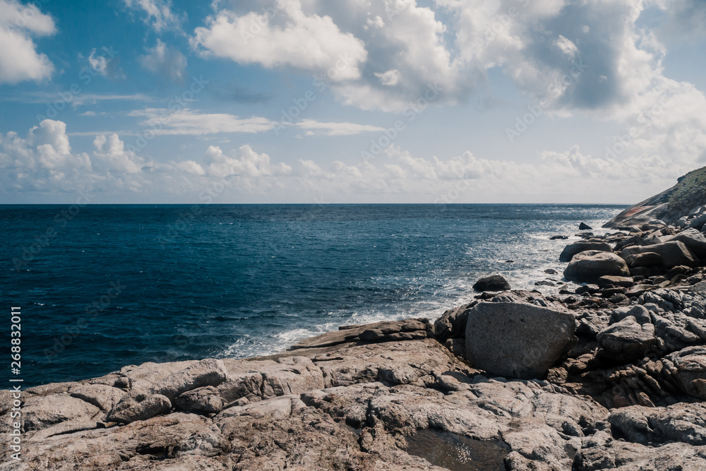 Wall mural rocky coast line of sea
