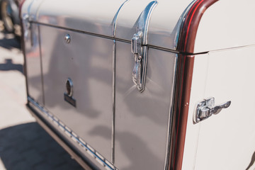 Old school trunk type suitcase on a retro car