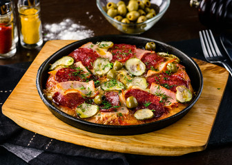 pan with roasted meat and vegetables