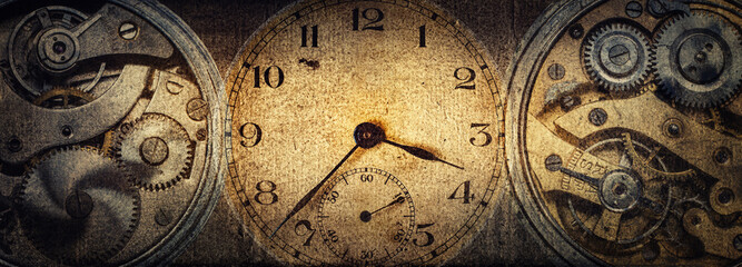 The dials of the old antique classic clocks on a vintage paper background. Concept of time,...
