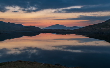Blue Hour shot in Snowdonia just before sunrise with red moody sky