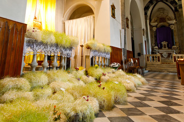 Alter in an italian church decorated with flowers for Easter holiday. Catholic church in Liguria...