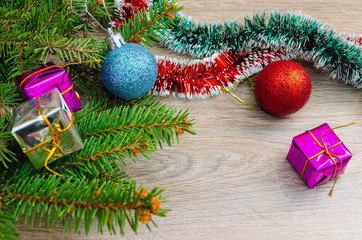 Christmas holidays, Christmas balls and gift boxes on wooden background