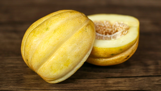 Cantaloupe or blewah on wood background. 