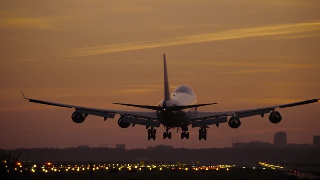 Jumbojet landing at dawn
