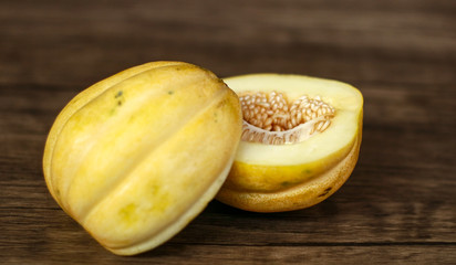 Cantaloupe or blewah on wood background. 
