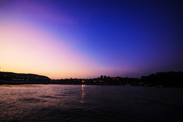 Fototapeta na wymiar Beautiful Sunset and Silhouette of river near mon wooden bridge at Sangkhlaburi, Thailand