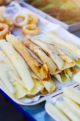 Thai sweet dessert. Thai Coconut Crepes on tray in local market