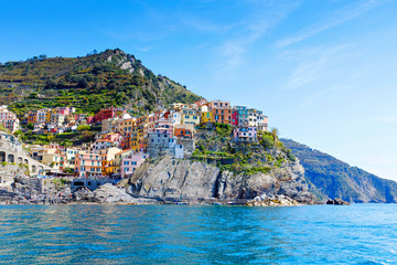 Fototapeta na wymiar Manarola, Liguria, Italy fisherman village, colorful houses on sunny warm day. Monterosso al Mare, Vernazza, Corniglia, Manarola and Riomaggiore, Cinque Terre National Park UNESCO World Heritage