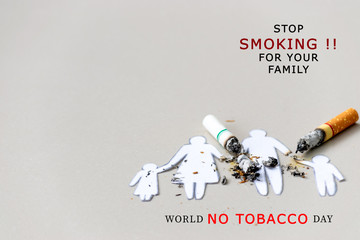 Paper cut of family destroyed by cigarettes. Drugs destroying family concept. Quit smoking for life...