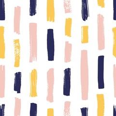Modern seamless pattern with yellow, pink, blue brush strokes on white background. Creative backdrop with vertical paint traces or smears. Artistic vector illustration for textile print, wallpaper.